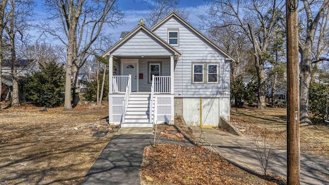 view of front of house with a porch and stairway