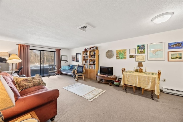 carpeted living room featuring a baseboard heating unit and a textured ceiling