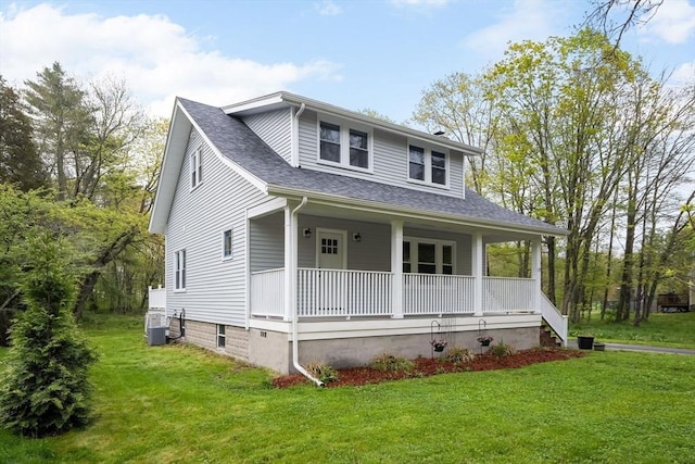 129 S Main St, Raynham, MA 02767 - bungalow featuring a porch, a front yard, a shingled roof, and central AC