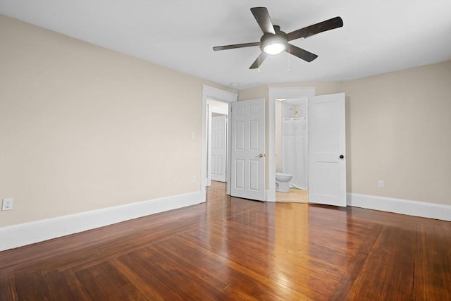 129 S Main St, Raynham, MA 02767 - unfurnished bedroom featuring baseboards, ensuite bath, wood finished floors, and ceiling fan