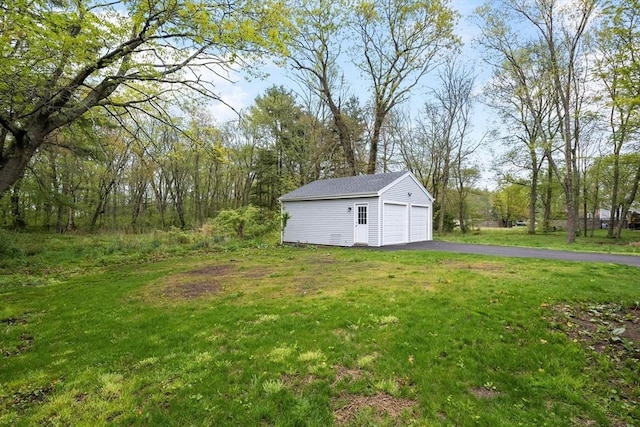 129 S Main St, Raynham, MA 02767 - view of grassy yard with an outbuilding and a detached garage