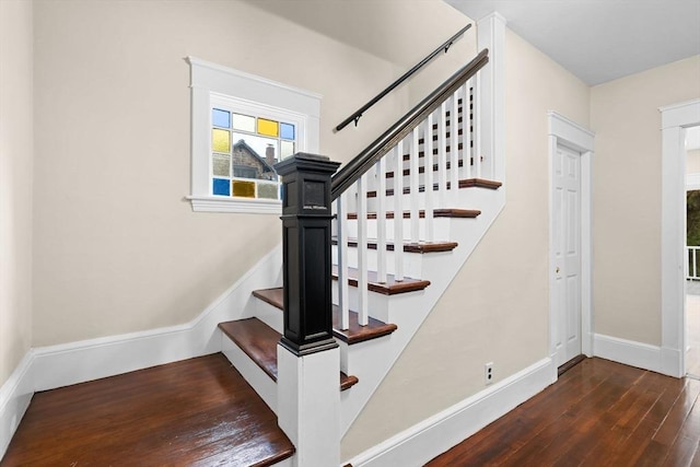 129 S Main St, Raynham, MA 02767 - staircase featuring hardwood / wood-style flooring and baseboards