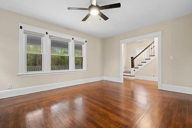 129 S Main St, Raynham, MA 02767 - empty room featuring stairs, a ceiling fan, baseboards, and hardwood / wood-style flooring