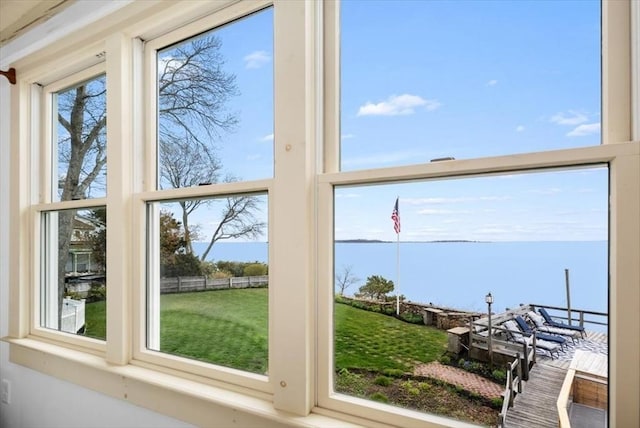 doorway to outside with a water view