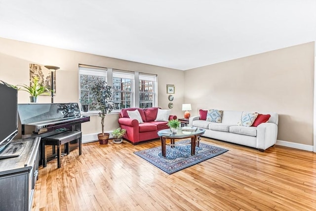 living room with light hardwood / wood-style flooring