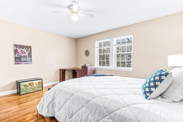 bedroom with wood-type flooring and ceiling fan