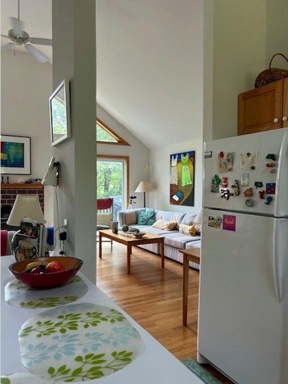 190 Longview Rd, West Tisbury, MA 02575 - living room with light wood finished floors, ceiling fan, and high vaulted ceiling