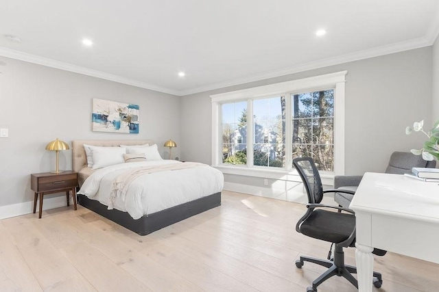 bedroom with light wood-style flooring, ornamental molding, and baseboards