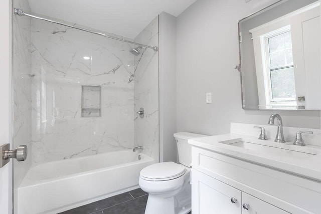 bathroom with toilet, tile patterned flooring, washtub / shower combination, and vanity