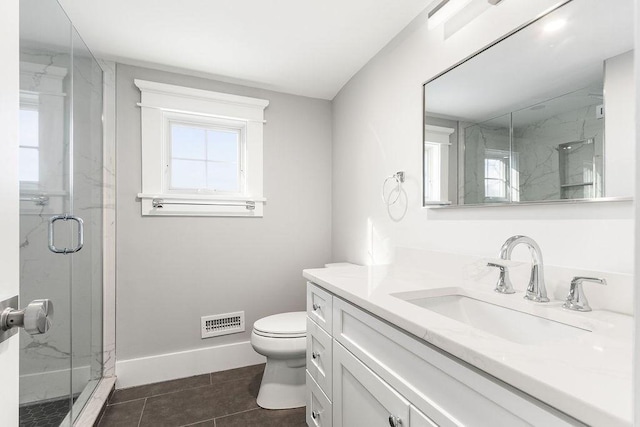 bathroom with toilet, baseboards, a marble finish shower, and visible vents