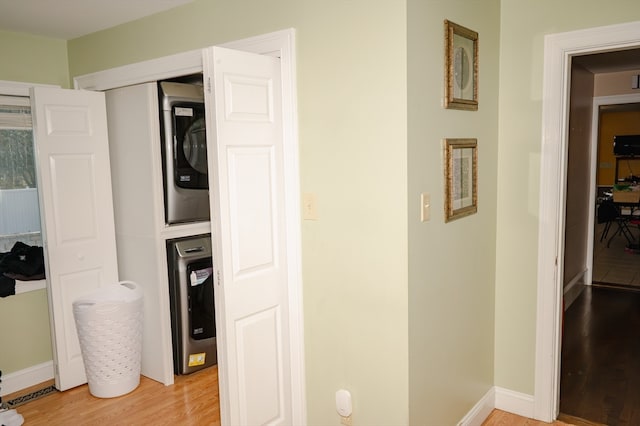 interior space with stacked washing maching and dryer