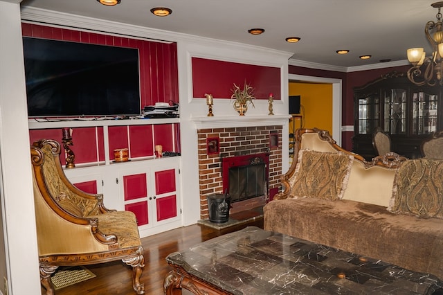 living room with a fireplace, wood-type flooring, and crown molding