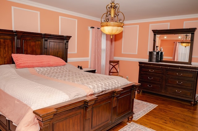 bedroom with crown molding and dark wood-type flooring