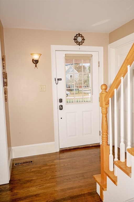 entrance foyer with dark hardwood / wood-style flooring