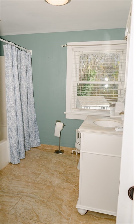 full bathroom with shower / bath combo, vanity, and toilet