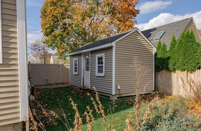 view of outbuilding featuring a yard