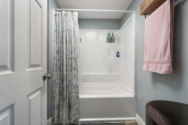 bathroom with shower / bath combo with shower curtain