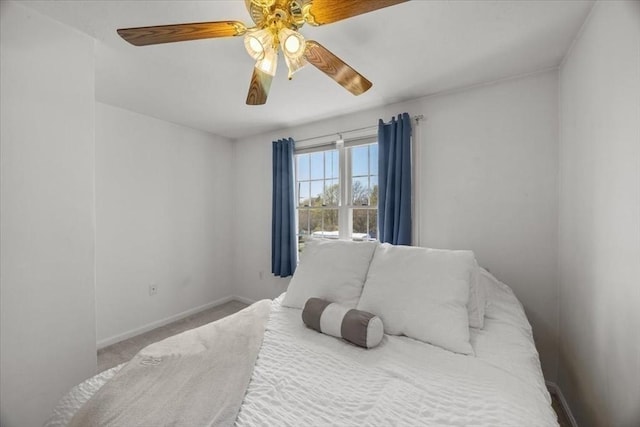 bedroom featuring baseboards, a ceiling fan, and carpet floors