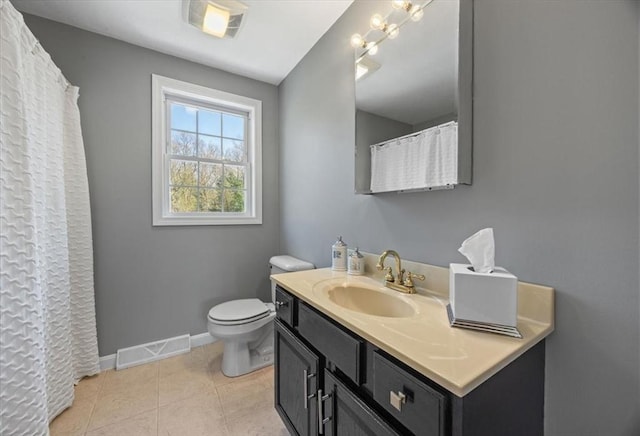 bathroom with tile patterned flooring, vanity, toilet, baseboards, and visible vents