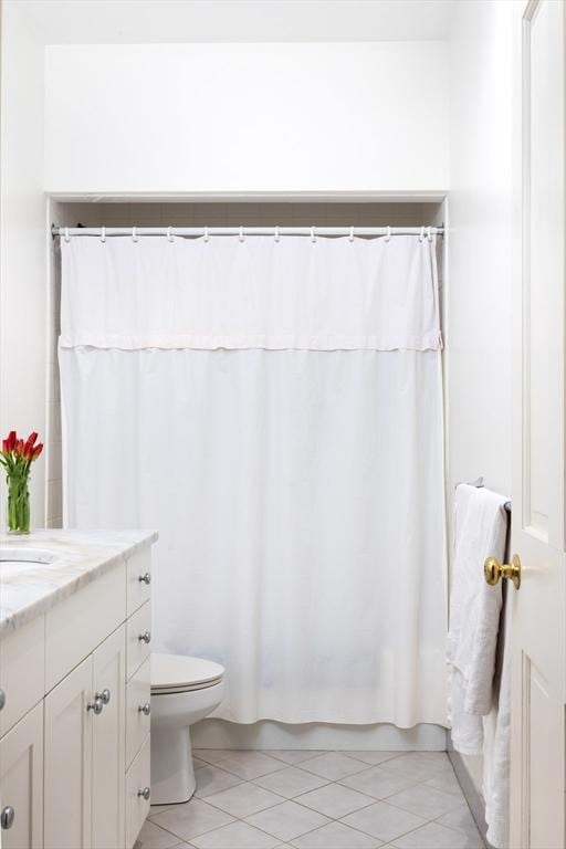 371 Walnut St, Brookline, MA 02445 - bathroom featuring tile patterned floors, shower / tub combo with curtain, toilet, and vanity