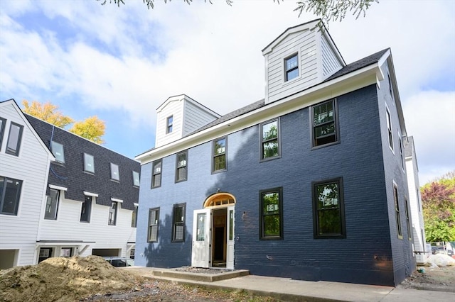 view of front of home featuring brick siding