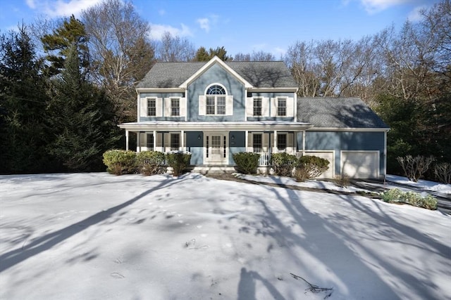 view of front of property featuring a garage and a porch