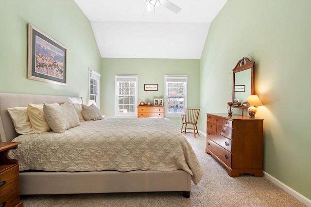 bedroom with baseboards, lofted ceiling, light colored carpet, and a ceiling fan