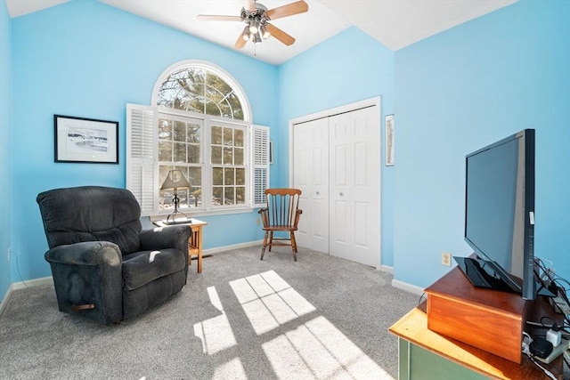 living area with ceiling fan, baseboards, lofted ceiling, and carpet