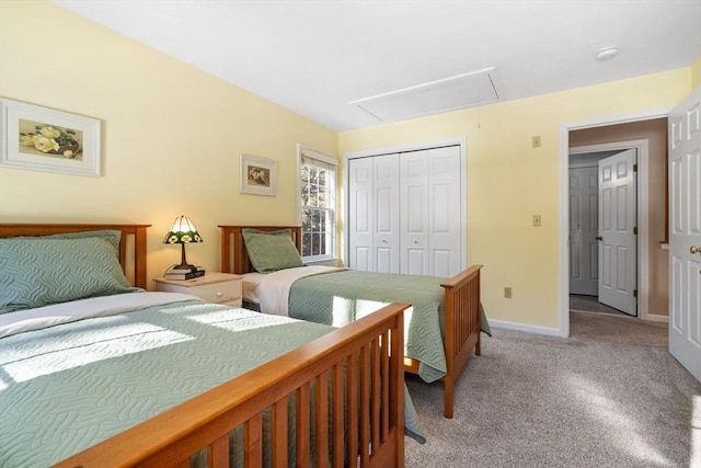 bedroom featuring attic access, baseboards, a closet, and light carpet