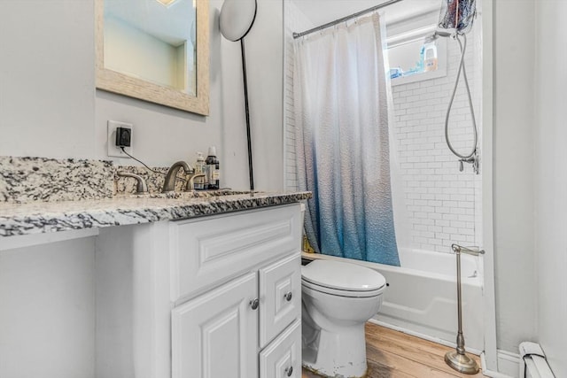 full bath featuring a baseboard radiator, toilet, shower / tub combo with curtain, vanity, and wood finished floors