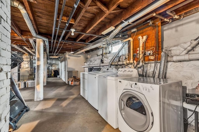 laundry area featuring washing machine and clothes dryer and laundry area