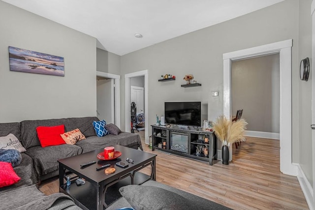 living room with wood finished floors and baseboards
