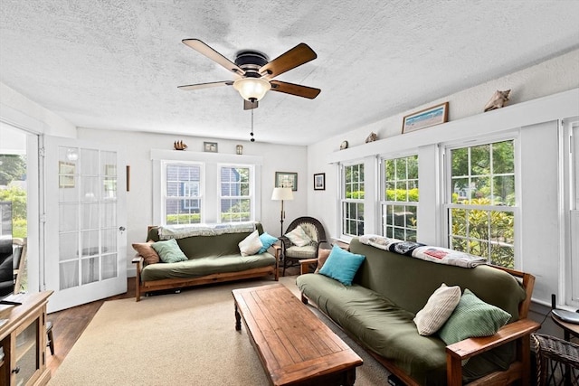590 Hatherly Rd, Scituate, MA 02066 - living room with a ceiling fan, a textured ceiling, plenty of natural light, and wood finished floors