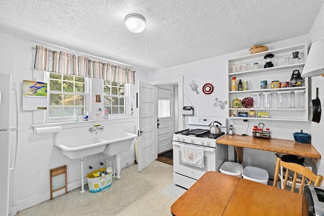 590 Hatherly Rd, Scituate, MA 02066 - kitchen with white appliances, a textured ceiling, and light floors