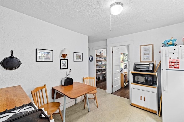 590 Hatherly Rd, Scituate, MA 02066 - office space featuring tile patterned floors, a textured ceiling, and a textured wall