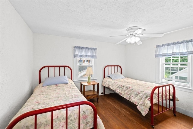 590 Hatherly Rd, Scituate, MA 02066 - bedroom with wood finished floors, a textured ceiling, and a ceiling fan