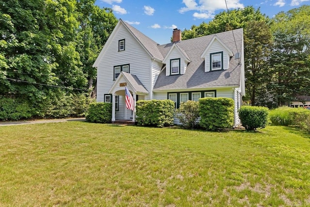 590 Hatherly Rd, Scituate, MA 02066 - view of front facade featuring a chimney, a front lawn, and a shingled roof