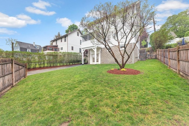 view of yard with french doors