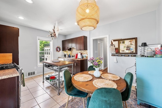 115 Elm St, Somerville, MA 02144 - dining area with light tile patterned flooring, baseboards, and recessed lighting