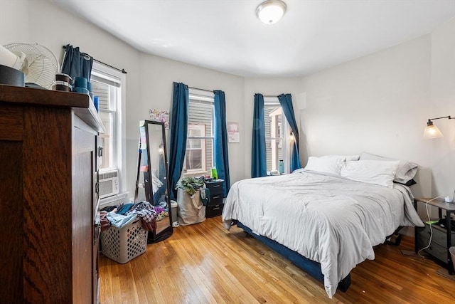 115 Elm St, Somerville, MA 02144 - bedroom with hardwood / wood-style floors, multiple windows, and cooling unit