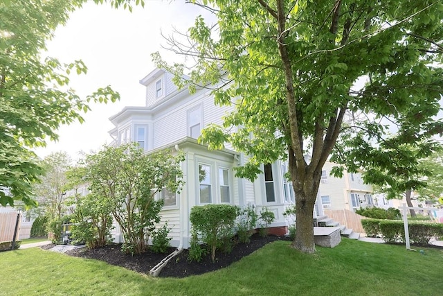 179 Main Unit 2, Medford, MA 02155 - view of side of home featuring a lawn