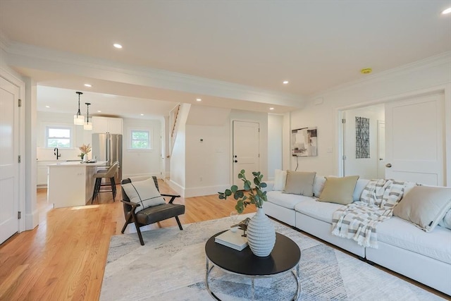 179 Main Unit 2, Medford, MA 02155 - living room featuring light wood-style flooring, crown molding, recessed lighting, and baseboards