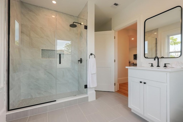 179 Main Unit 2, Medford, MA 02155 - bathroom featuring a stall shower, vanity, tile patterned flooring, and recessed lighting