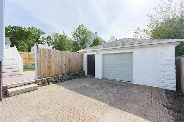 179 Main Unit 2, Medford, MA 02155 - detached garage featuring decorative driveway