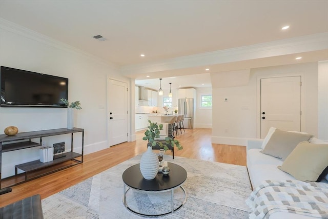 179 Main Unit 2, Medford, MA 02155 - living room featuring crown molding, light wood finished floors, baseboards, and recessed lighting
