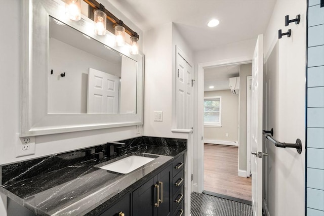 13 Campello Rd, Framingham, MA 01701 - bathroom with vanity, tile patterned flooring, recessed lighting, baseboards, and a baseboard heating unit