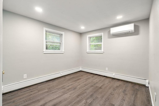 13 Campello Rd, Framingham, MA 01701 - spare room with a wall mounted AC, wood finished floors, recessed lighting, and baseboards