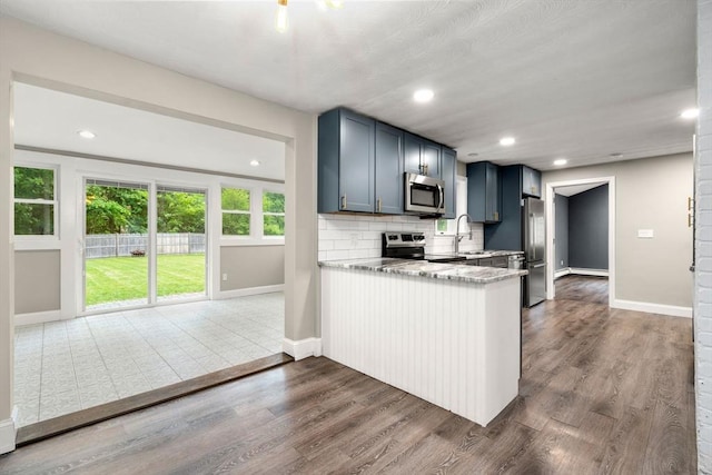 13 Campello Rd, Framingham, MA 01701 - kitchen with stainless steel appliances, baseboards, dark wood-type flooring, and recessed lighting