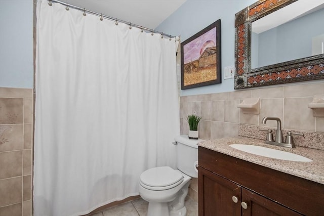 bathroom with toilet, tile walls, tile patterned flooring, a shower with shower curtain, and vanity