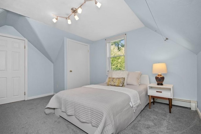 carpeted bedroom with vaulted ceiling and baseboards